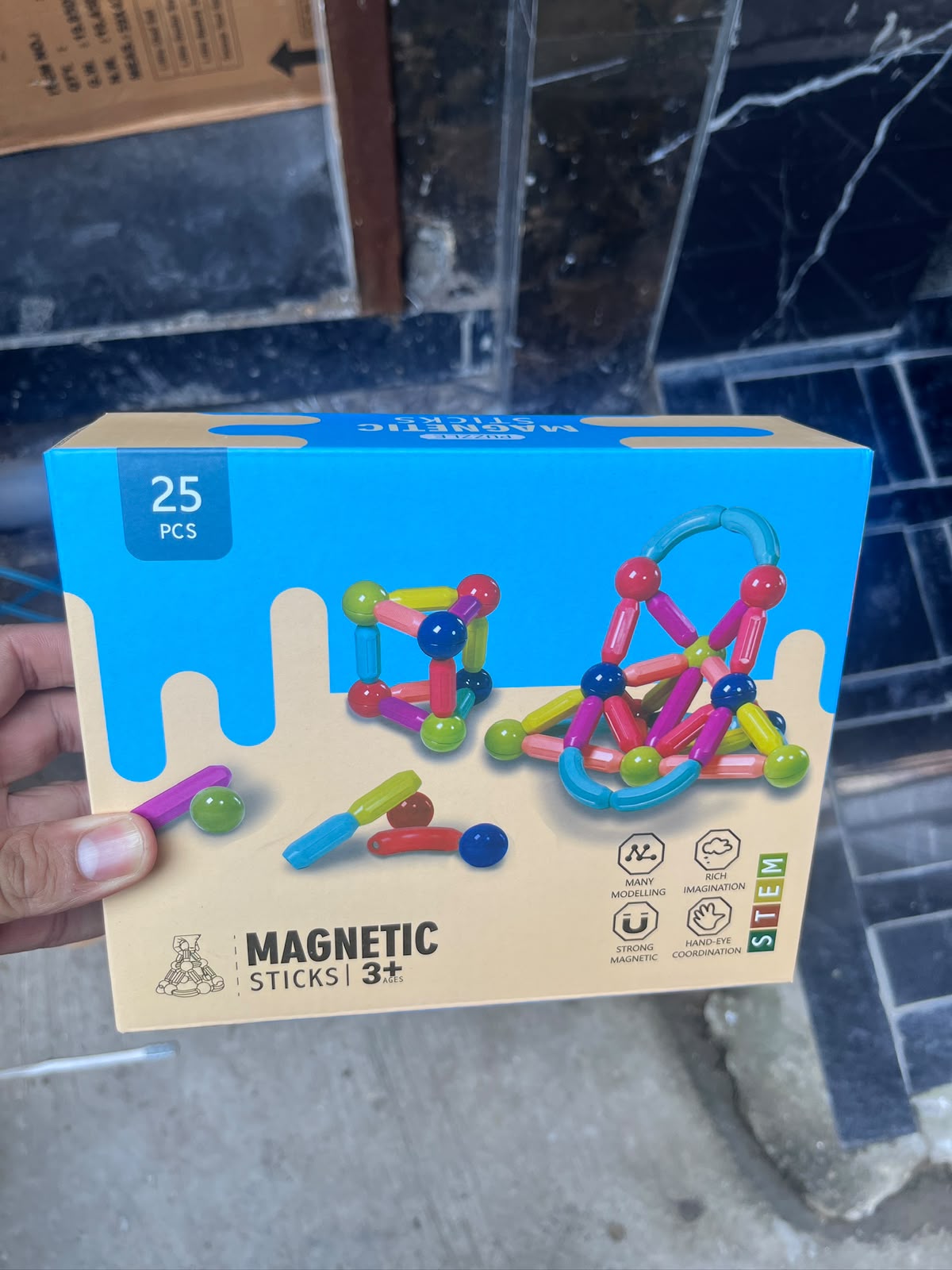 Real photo of magnetic sticks box